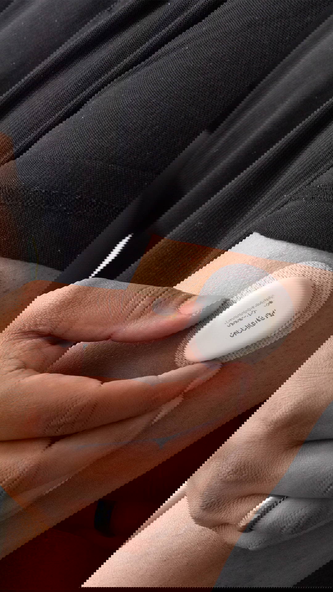 Yuwell Anytime CGM sensor being placed on the upper arm